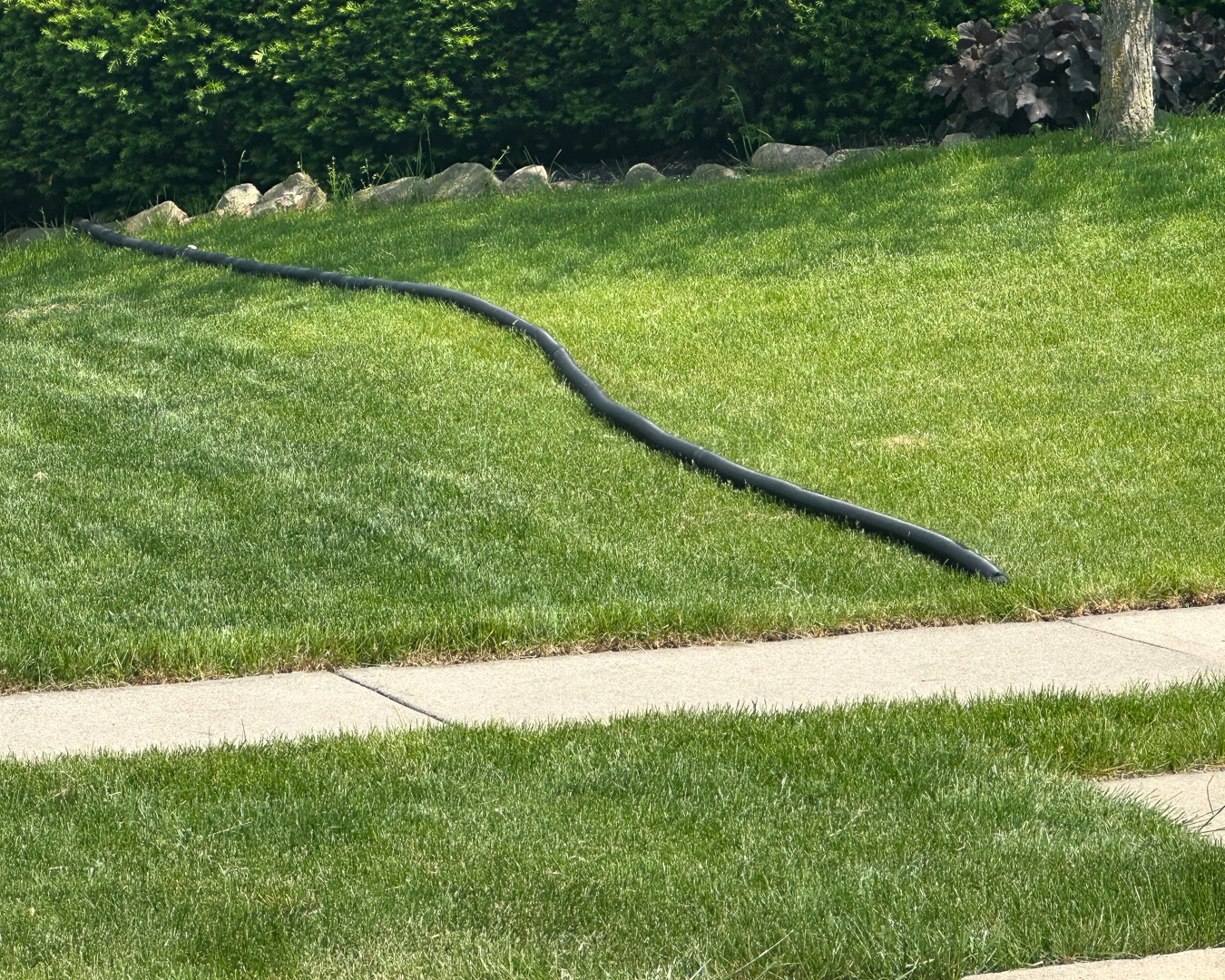 Sump Pump tube leads water away from the house towards the street or towards the back.